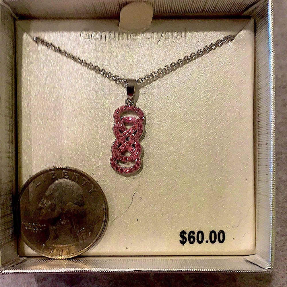 Pink crystal infinity silver-plated necklace.